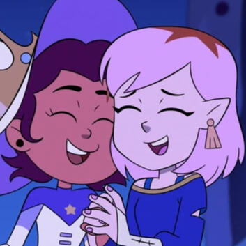 A picture of Luz and Amity from the Owl House. They are holding each others hands and laughing.